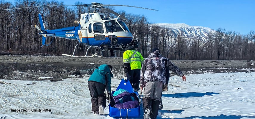 Alaska resident Christy Rutter survived hours stranded on a frozen river after a snowmobile crash.