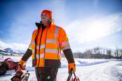 A man in a HiVis orange jacket.