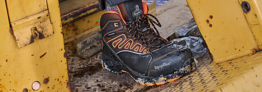 Refrigiwear durable footwear on the job outside on heavy machinery.