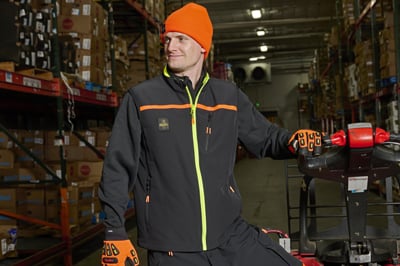A man working in workwear in a warehouse
