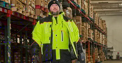 Man dressed in Polarforce PPE in a warehouse
