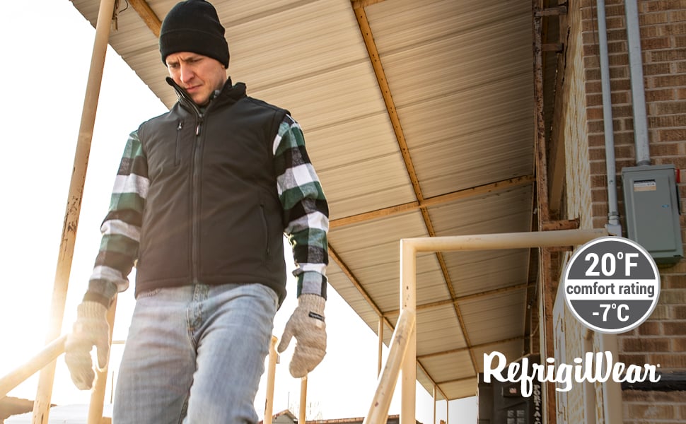Man walking outside in the cold wearing the Softshell vest