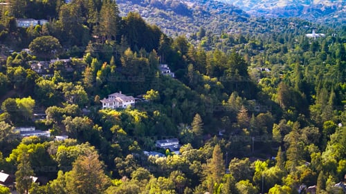 Aerial Picture of Kent Woodlands hillside homes, in Kentfield with University of Redlands in the background in Marin, California.
