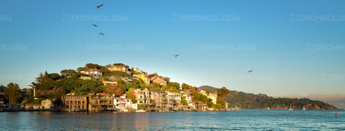 Picture at Sunset of Corinthian Island Homes with a view of Angel Island in the background taken from Tiburon, California.