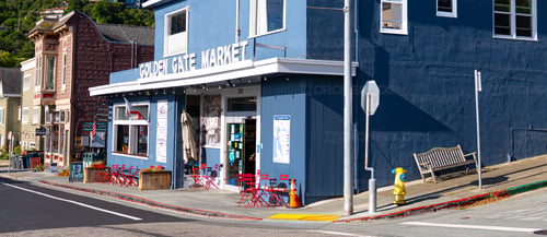Picture at Sunrise of Golden Gate Market with Cat In Window in Sausalito, California.
