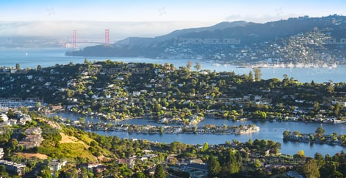 Picture of Sunset of Belvedere Island and Belvedere Lagoon with Golden Gate Bridgein the background taken from Tiburon, California hilltop.