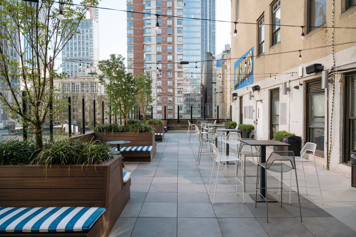 An interior shot of Rooftop Terrace overlooking the Empire State Building