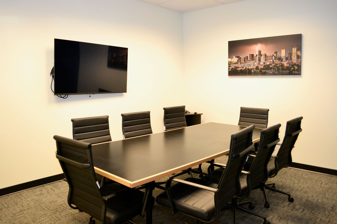 An interior shot of Medium Conference Room with TV Monitor