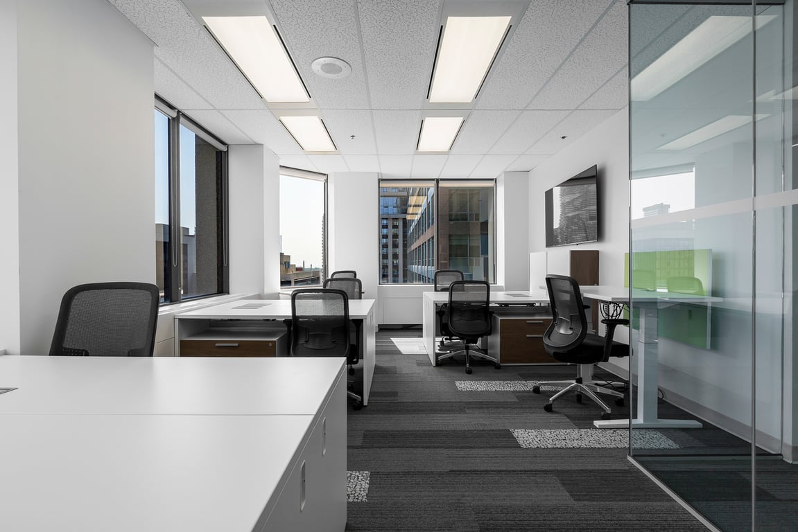 An interior shot of #10 7 Person Corner Window Office
