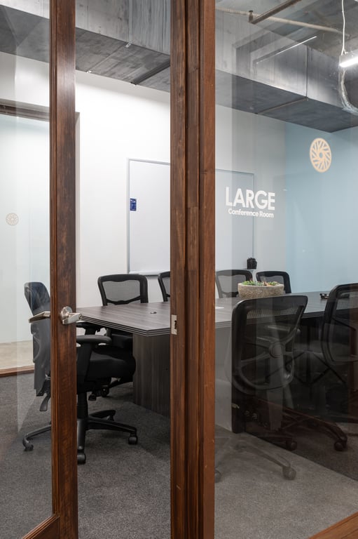 An interior shot of 10 Person Conference Room with Hybrid Presentation Displays
