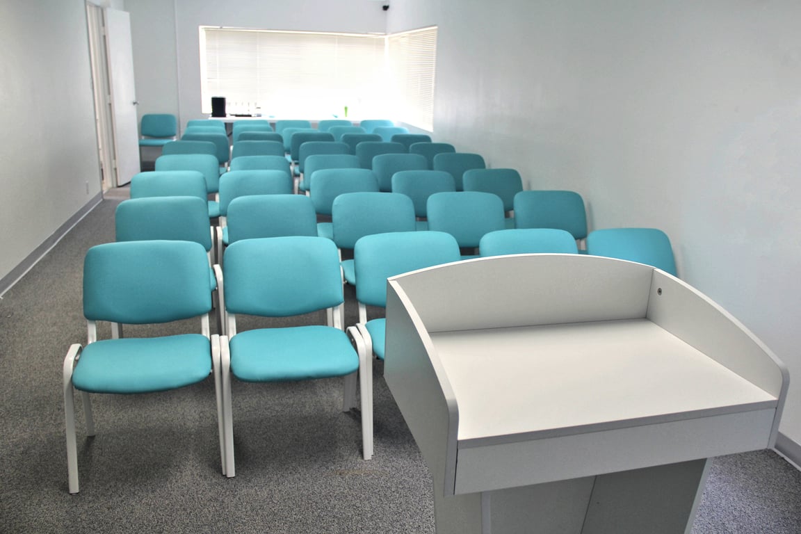 An interior shot of Blue Event Venue – Easy Access - Room #101, High-Impact Presentations (Up to 50 Guests)