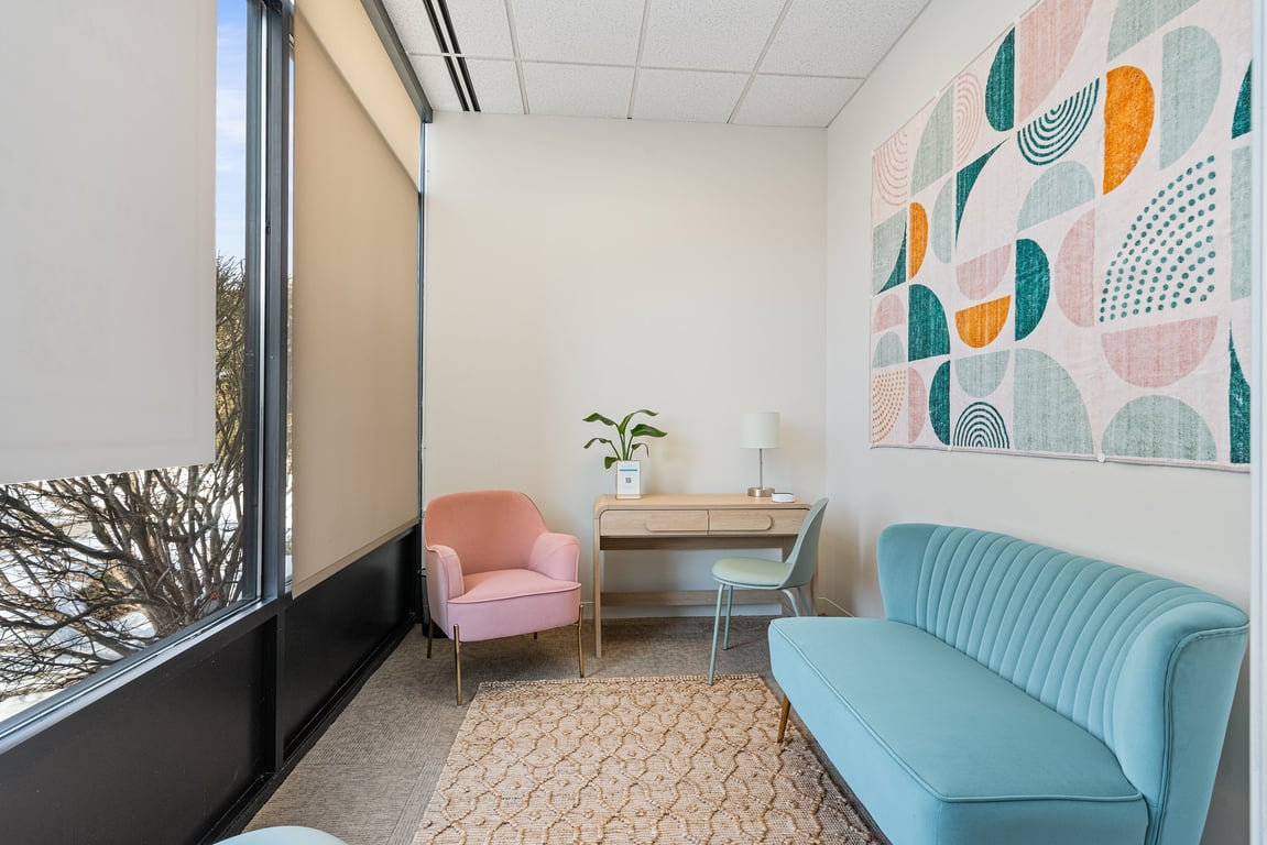 An interior shot of Private Day Office Window | Seats 3 | Sofa + Desk