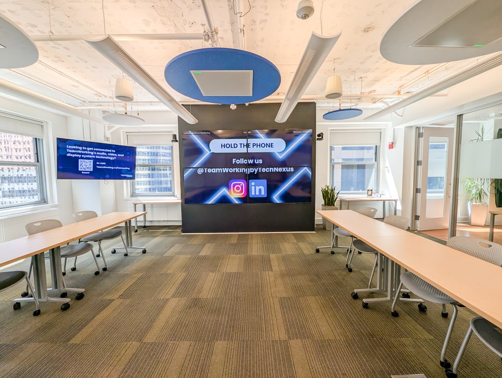 An interior shot of Conference Rooms C+D! Virtual Enabled Meeting Rooms with City Views | Ideal for In-Person & Virtual Off-sites | Bright & Modern in a Tech Focused Shared Workspace