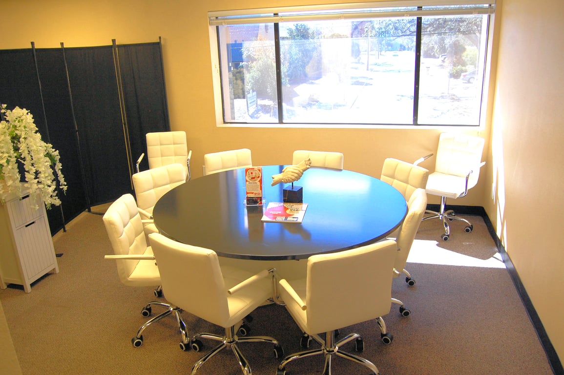 An interior shot of Executive Round Meeting Room #204 for 10 – Private & Collaborative Space.