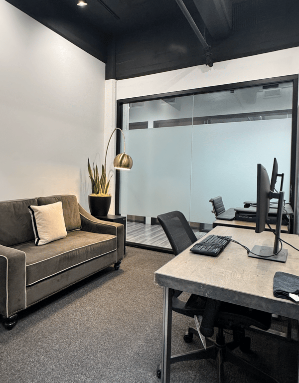 An interior shot of Office 210 - 2 Person Workspace with Whiteboard Wall