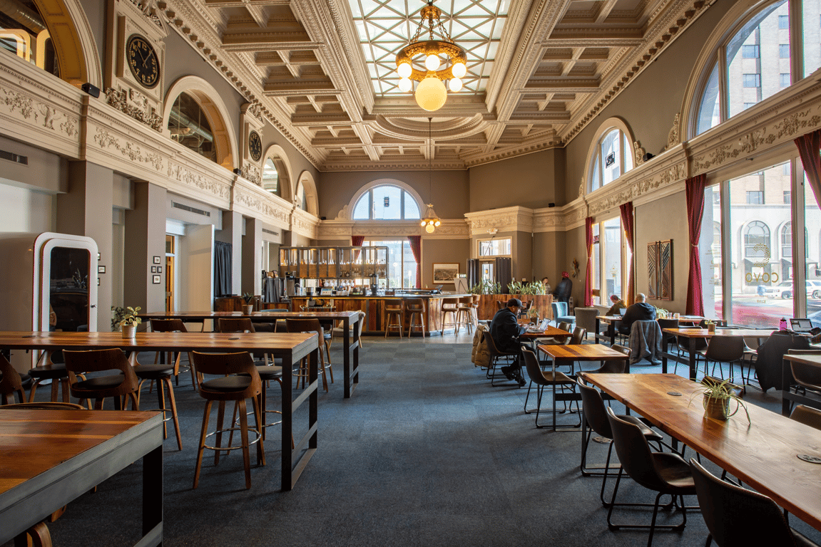 An interior view of Just steps away from The Arch and features historic architectural details a vibrant coworking community and beautiful meeting spaces..