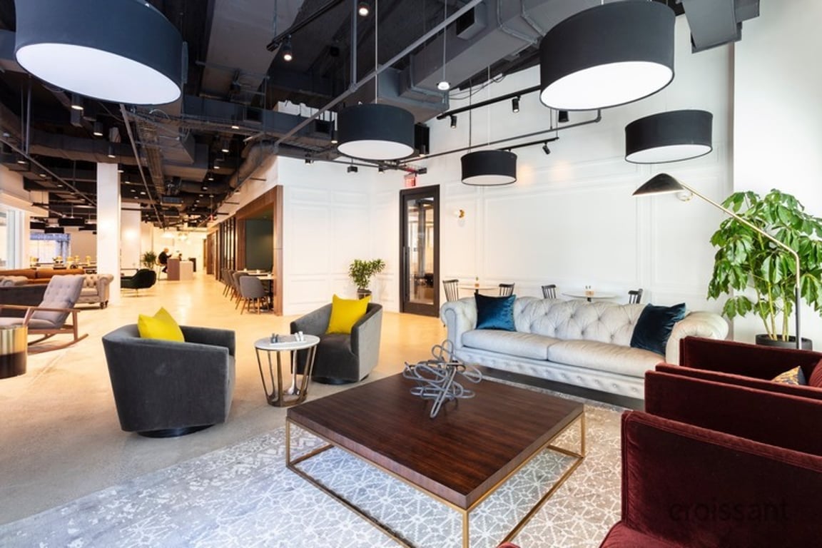 An interior view of The workspace boasts an 11-story glass atrium and fantastic views of downtown and the harbor..