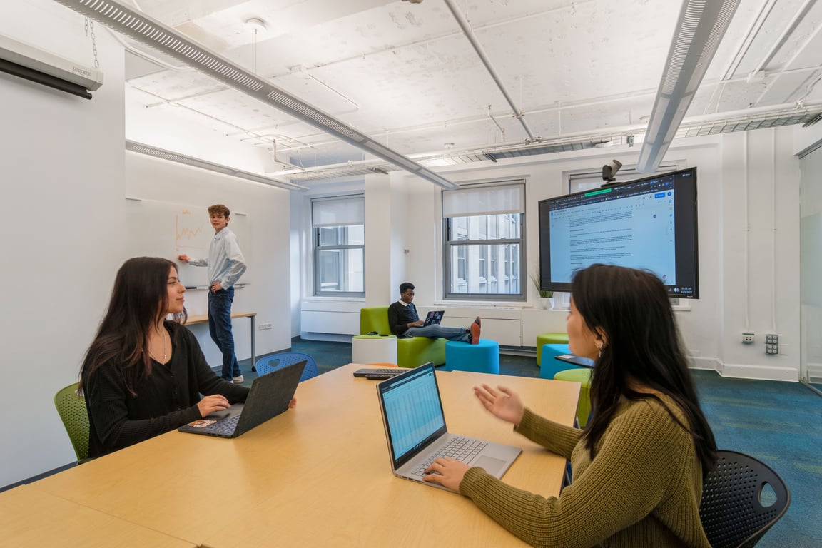 An interior shot of Collaboration Room Y! Virtual Enabled Meeting Rooms with City Views | Ideal for In-Person & Virtual Off-sites | Bright & Modern in a Tech Focused Shared Workspace