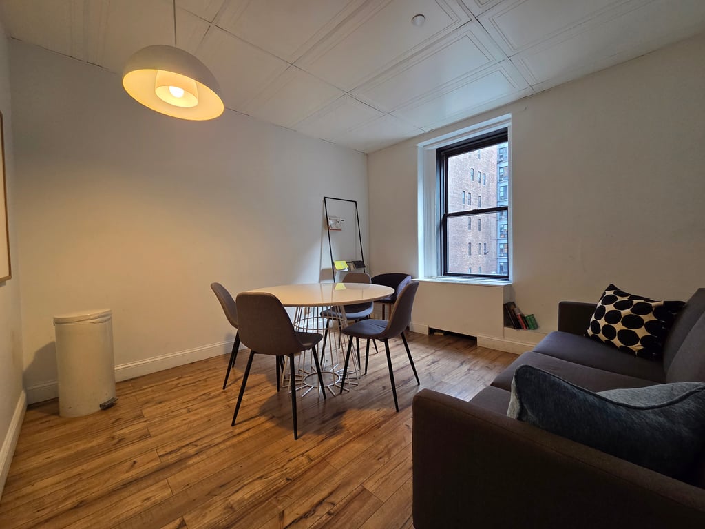 An interior shot of 704-G: 4-Person Meeting Room in Midtown Manhattan
