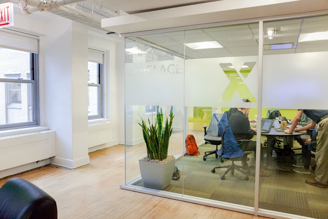 An interior shot of Virtual Enabled Meeting Rooms with City Views | Ideal for In-Person & Virtual Off-sites | Bright & Modern in a Tech Focused Shared Workspace! Lovelace Boardroom