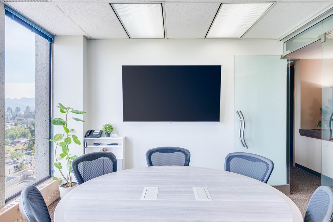An interior shot of Bright & Spacious Boardroom with Stunning Views of Downtown Vancouver