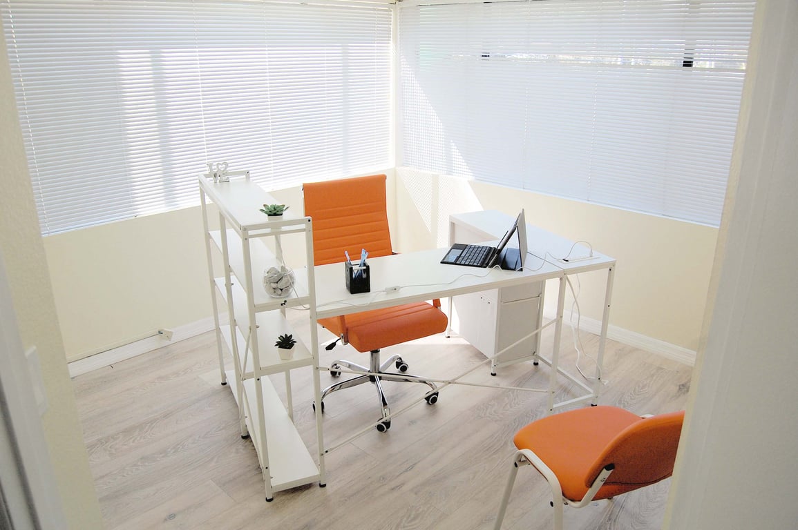 An interior shot of Private One Person Office  #104 – No Glass Division. Full Privacy. Double Window Executive Space.