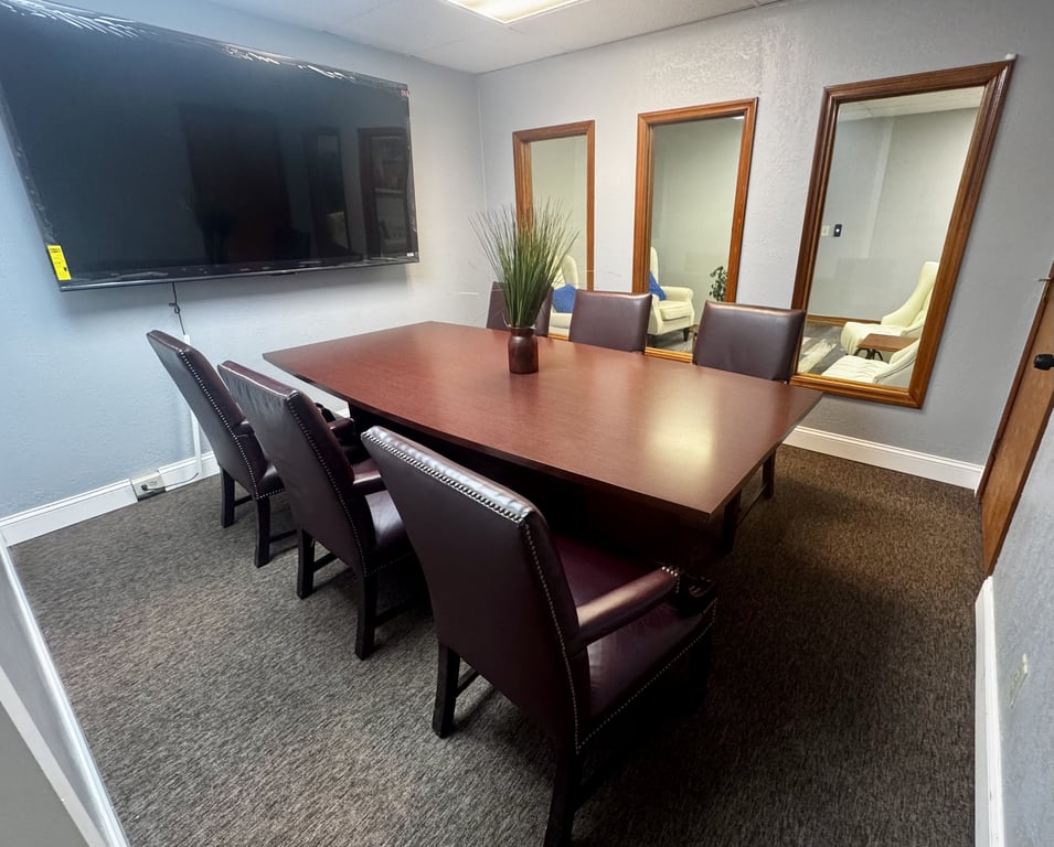 An interior shot of Executive Conference Room #103 for 6 – Private Space Designed for Professional Impact