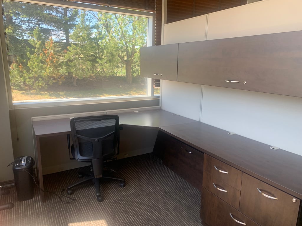 An interior shot of Spacious Desk by Window