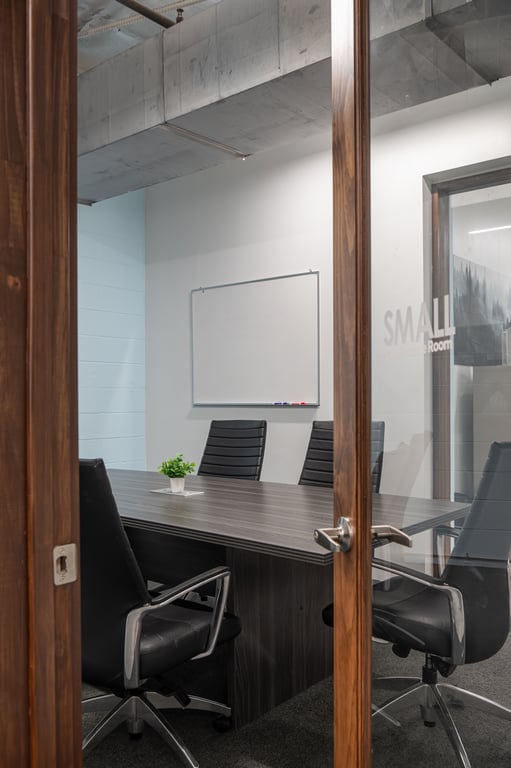 An interior shot of 6 Person Conference Room with Presentation Monitor