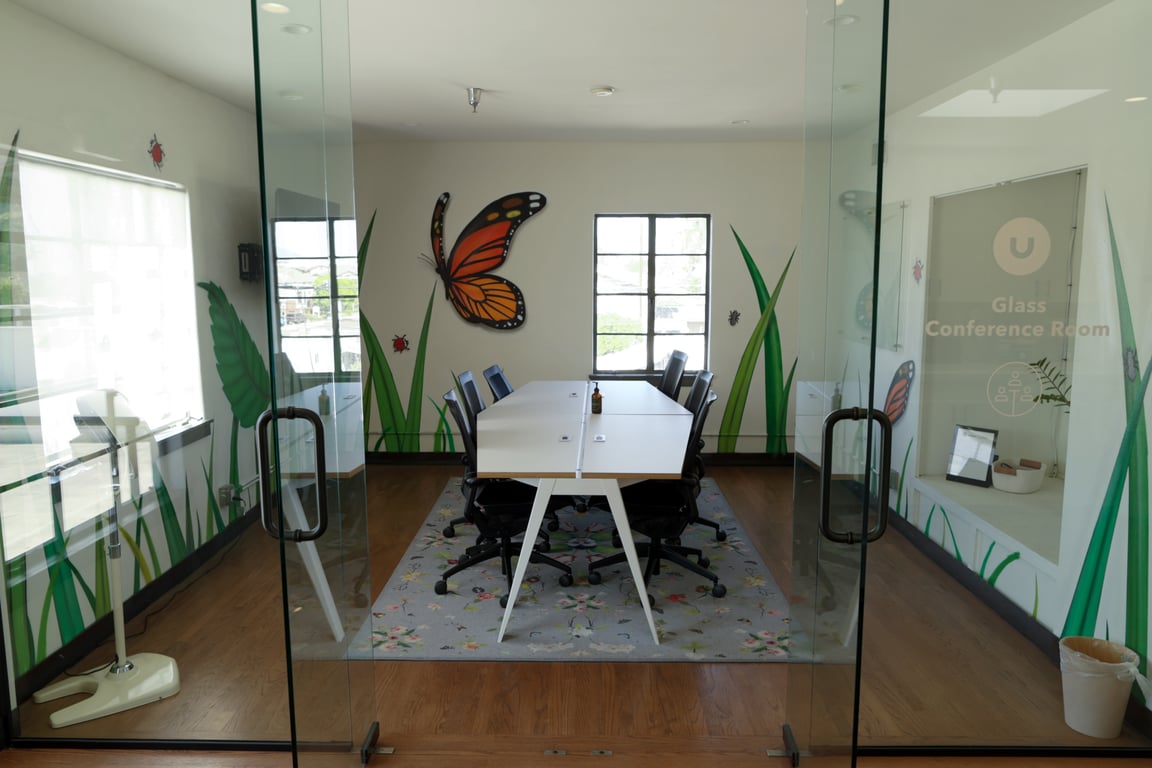 An interior shot of Upstairs Glass Conference Room