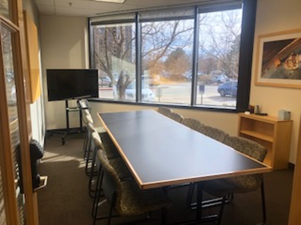 Large Conference Room with TV Monitor and Whiteboard
