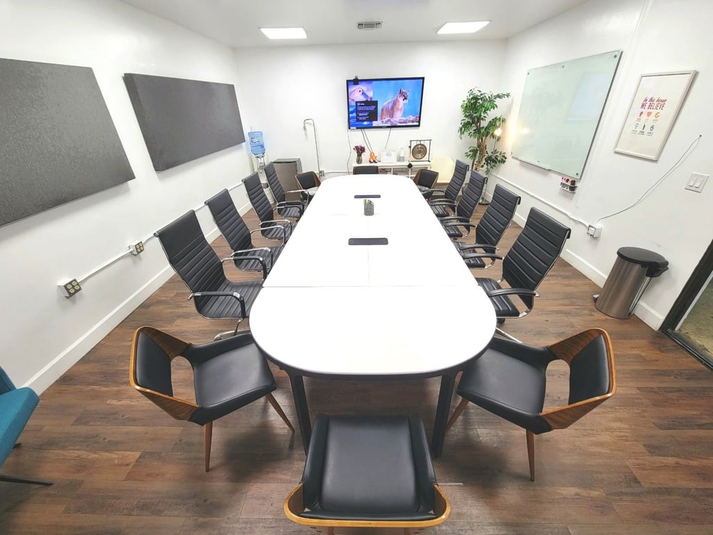 An interior shot of " OASIS" Suite 105 - 14 Person Conference Room
