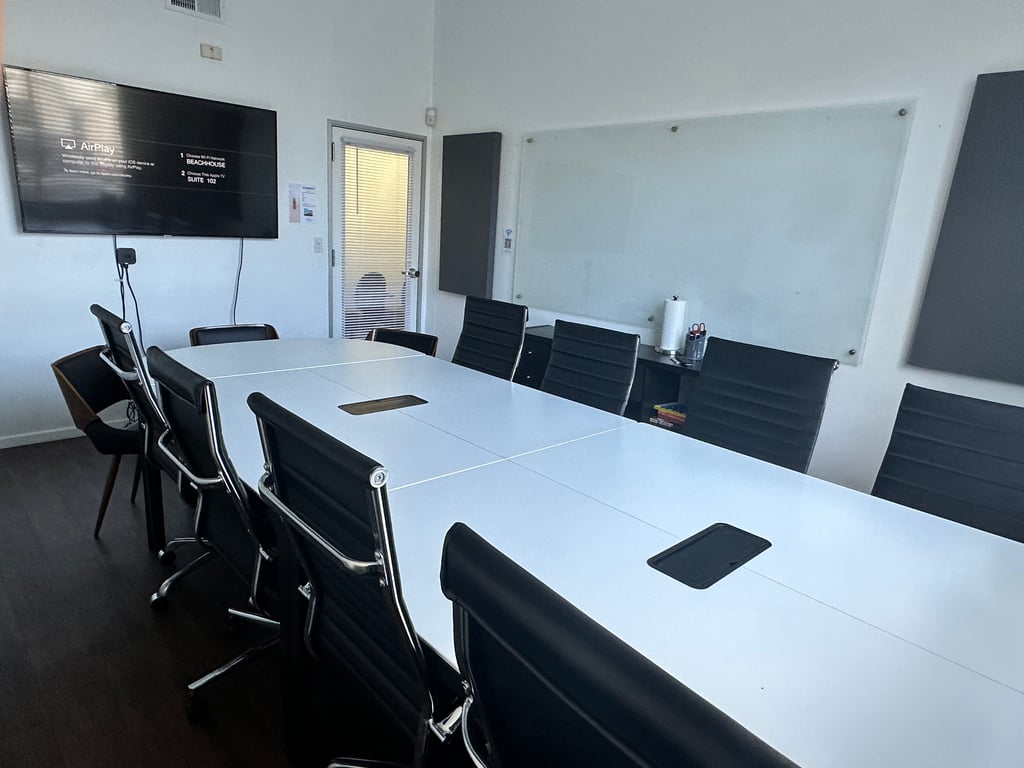 An interior shot of "SUNSET" Suite 102 - 8 Person Meeting Room
