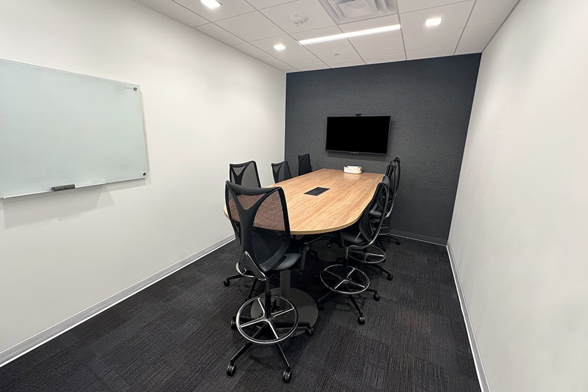 An interior shot of 7 Person Meeting Room