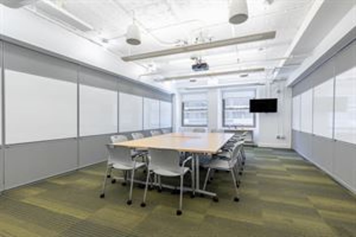 An interior shot of Conference Room B! Virtual Enabled Meeting Rooms with City Views | Ideal for In-Person & Virtual Off-sites | Bright & Modern in a Tech Focused Shared Workspace