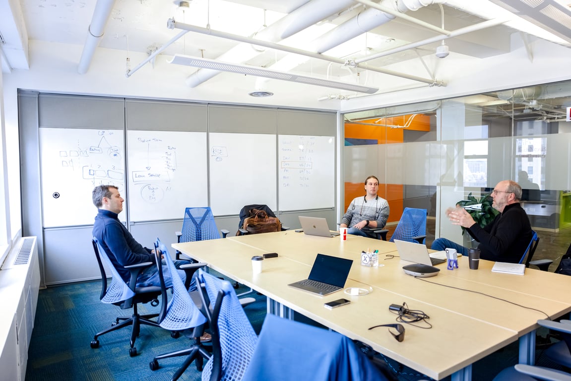 An interior shot of Babbage Boardroom! Virtual Enabled Meeting Rooms with City Views | Ideal for In-Person & Virtual Off-sites | Bright & Modern in a Tech Focused Shared Workspace