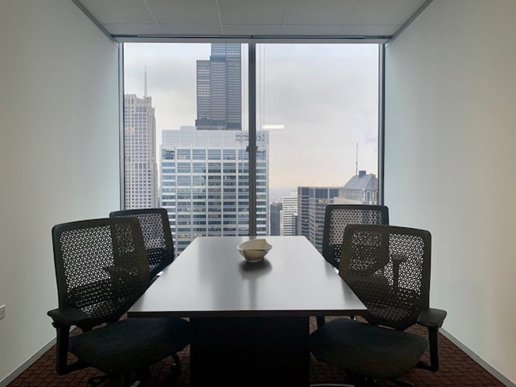 An interior shot of 4 person meeting room