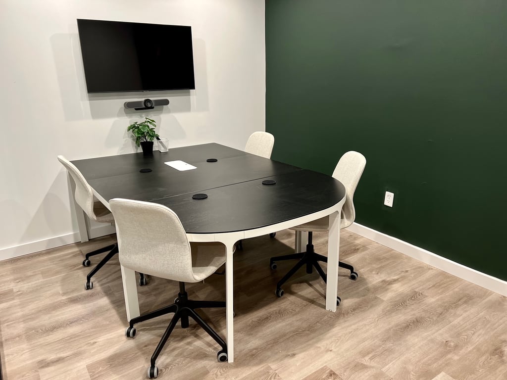 An interior shot of 4-Person Meeting Room