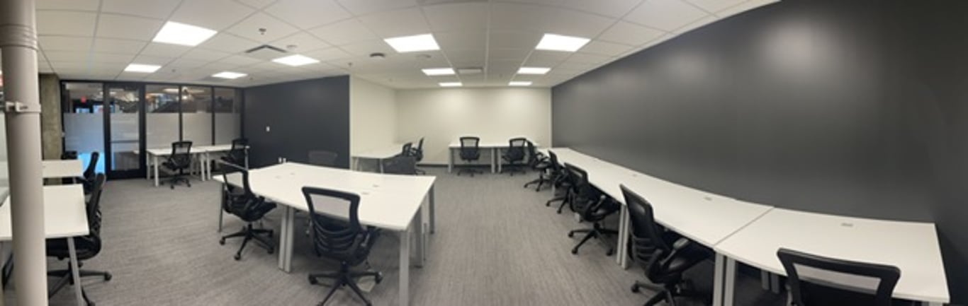 An interior shot of 3 person office with downtown view