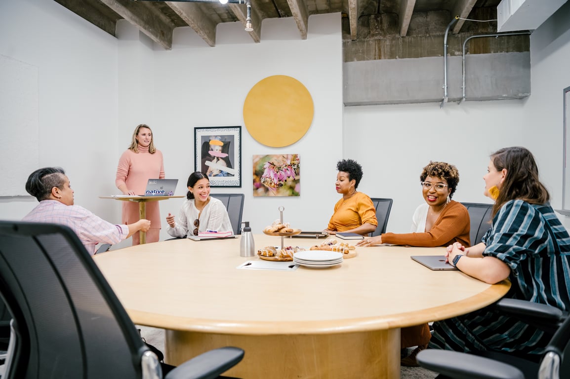 An interior shot of 10 Person Large Conference Room with Round Table
