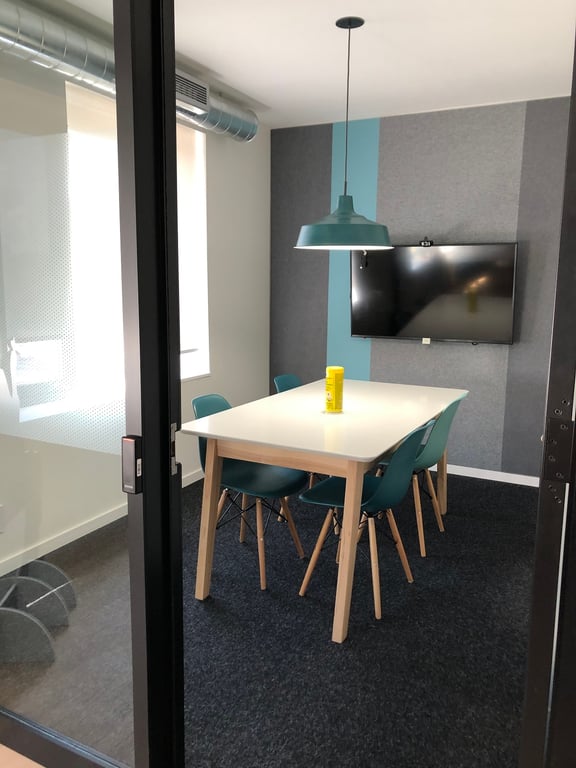 An interior shot of 4 person meeting room