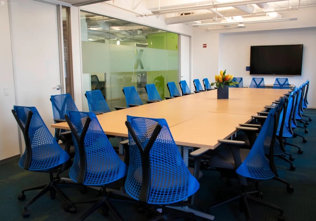 An interior shot of Virtual Enabled Meeting Rooms with City Views | Ideal for In-Person & Virtual Off-sites | Bright & Modern in a Tech Focused Shared Workspace! Babbage + Cerf Boardroom