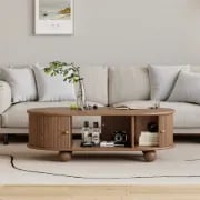 صورة طاولة قهوة توندو بيضاوية – خشب طبيعي مع تخزين وأرجل دائرية