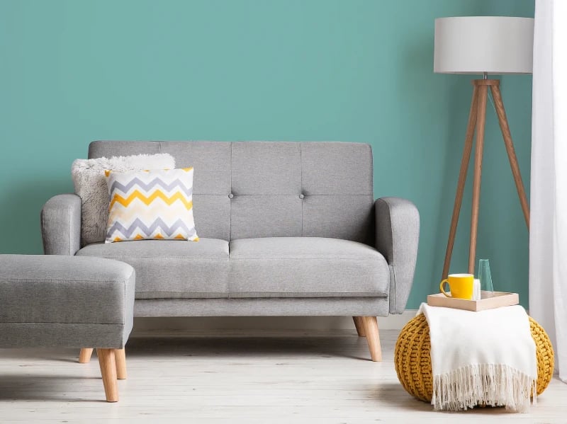 Éliane Convertible Sofa from natural wood legs  & Tufted Backrest.