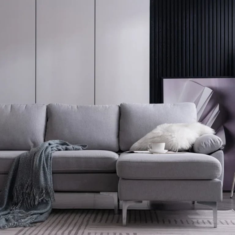 صورة مودين كنبة ركنية على شكل حرف الـ – بقاعدة من الخشب الطبيعي