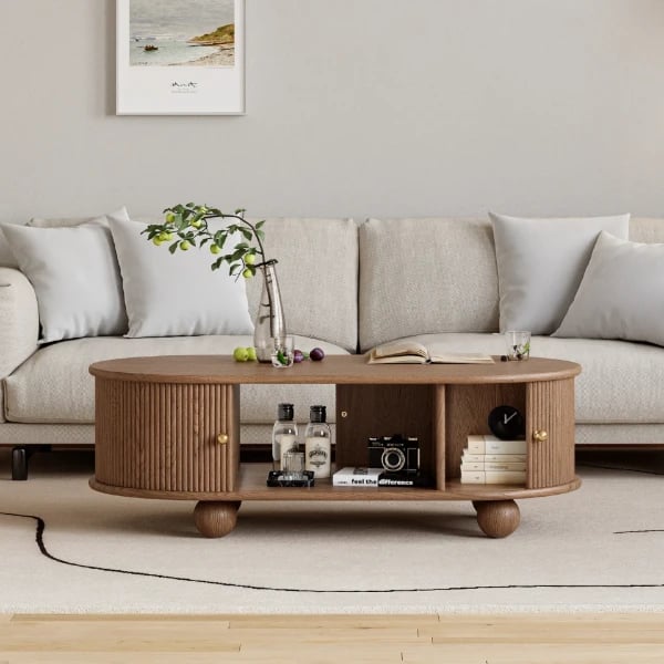 صورة طاولة قهوة توندو بيضاوية – خشب طبيعي مع تخزين وأرجل دائرية