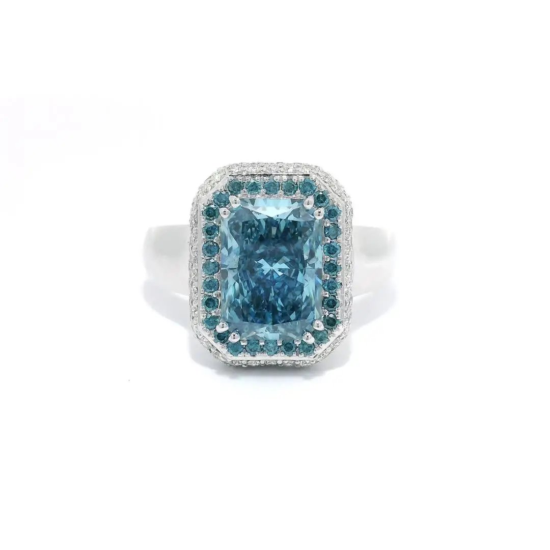 a front angle photo of a ring with blue gemstone on a white background. 