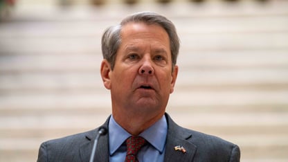 Georgia Gov. Brian Kemp speaks at a presser.