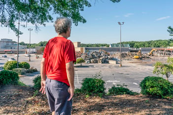 The long-awaited demolition of North DeKalb Mall had the air of a state funeral, as public officials past and present gathered Wednesday to say goodbye to one era of commercial development while celebrating the start of a new one.