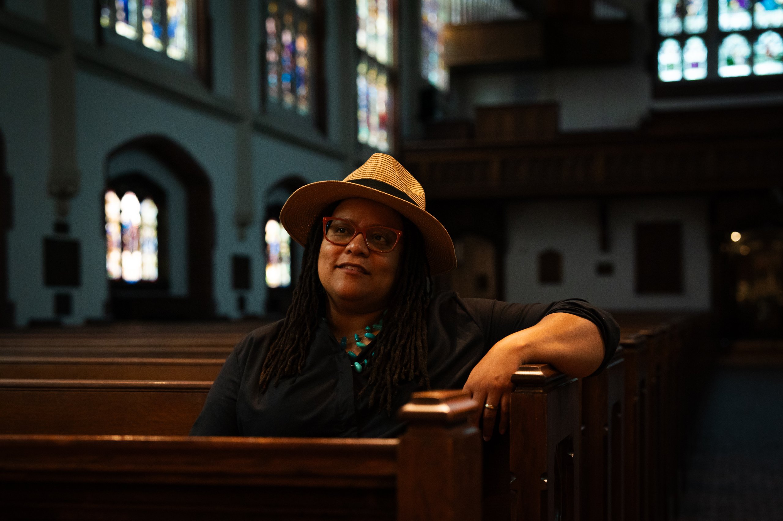 Kim Jackson, Georgia's first openly gay senator, sits in a pew at St. Luke's Episcopal Church in Atlanta.